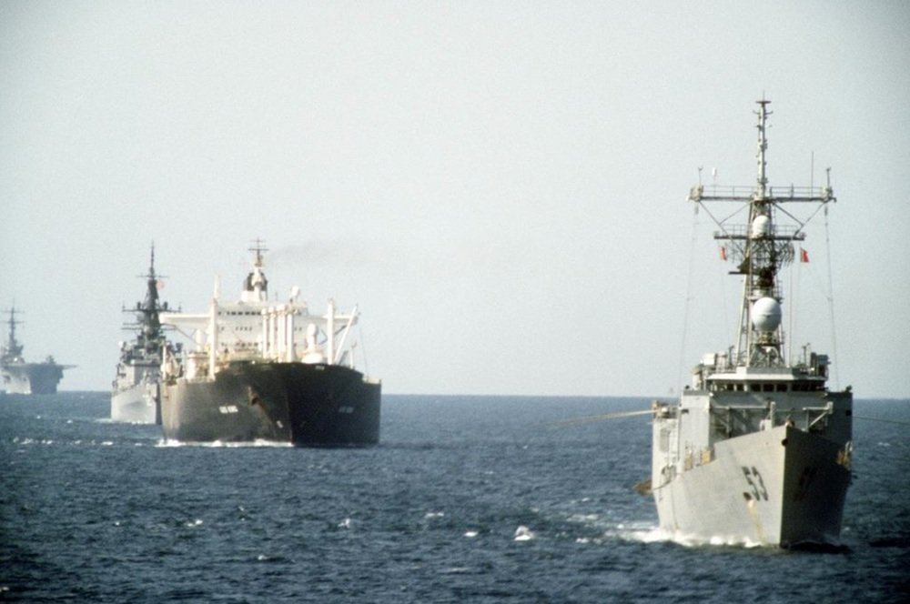 U.S. Navy warships escort a reflagged tanker during the last full-scale wartime disruption of the Persian Gulf shipping lanes, Operation Earnest Will, 1987 (USN)